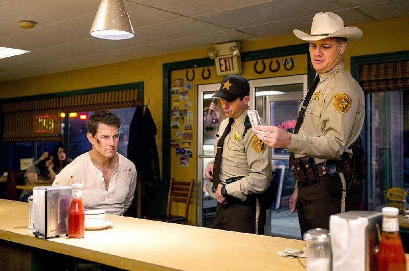 The shackled Jack Reacher (Tom Cruise) has this corrupt Oklahoma sheriff and his deputy right where he wants them in Jack Reacher: Never Go Back, the second installment of what’s probably going to be a long-running action franchise.