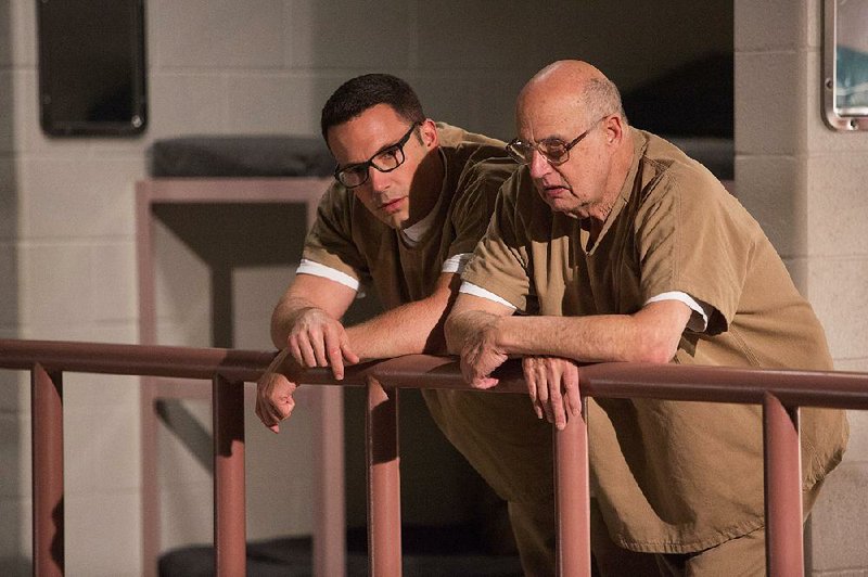Ben Affleck (left) plays Christian Wolff and Jeffrey Tambor is Francis Silverberg in The Accountant. The film came in first at last weekend’s box office and made about $24.7 million.