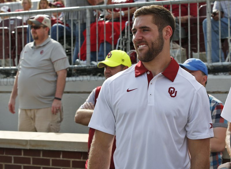 Former Oklahoma quarterback Trevor Knight watches from the sidelines before an NCAA college football game between Kansas State and Oklahoma in Norman, Okla., Saturday, Oct. 15, 2016.