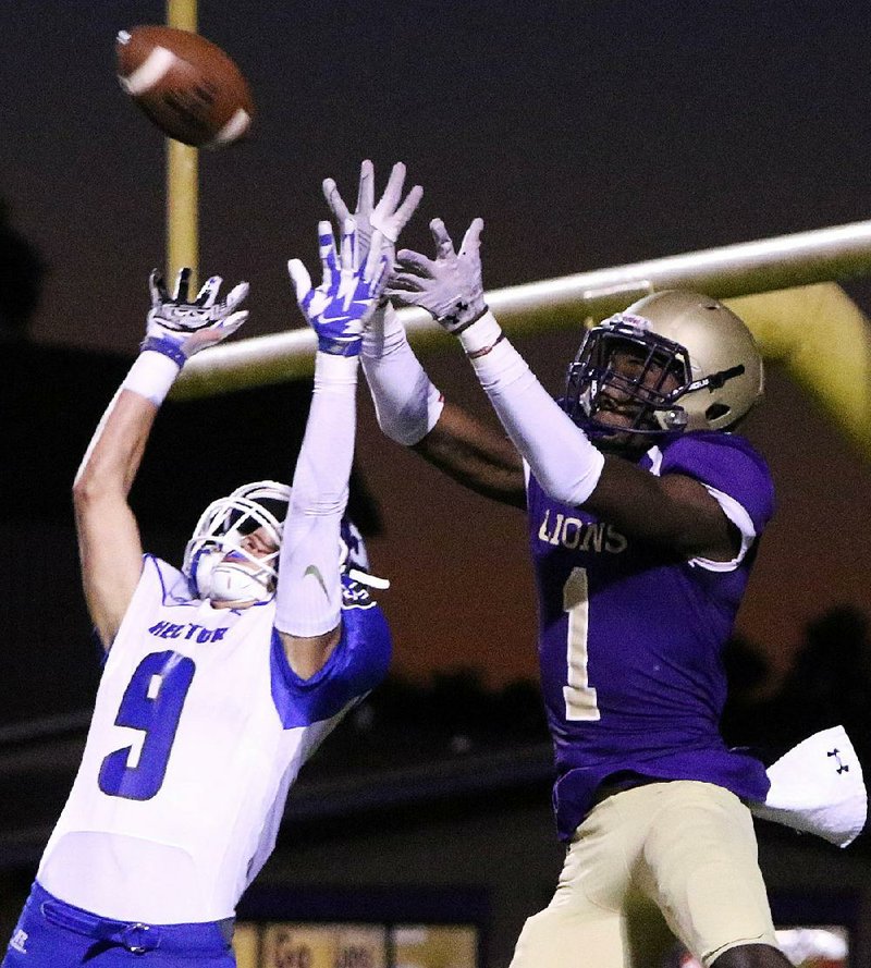 England’s B.J. Thompson (1) leaps to make a touchdown reception over Hector’s Jacob Hendrix during Friday night’s game at England. The Lions won 35-6 to remain undefeated.