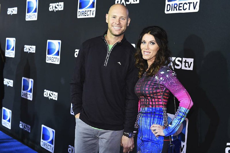 New York Giants kicker Josh Brown (left) was placed on the NFL’s paid exempt list Friday while the league investigates whether he should be suspended as punishment for several alleged acts of spousal abuse. Brown did not travel with the Giants to London after Wednesday’s release of police records, which contained the player’s written admissions that he physically abused his wife, Molly (right), over a protracted period.