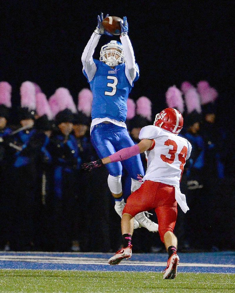 Bryant’s Reece Coats (3) leaps to make a touchdown catch in front of Cabot defensive back Austin Swackhammer on Friday night. See more photos at arkansasonline.com/galleries.