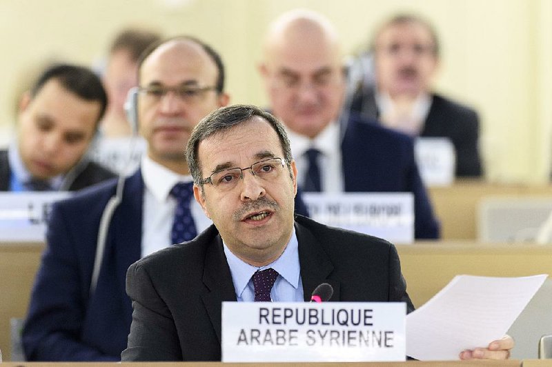 Houssam-Eddin Ala, a Syrian ambassador, speaks Friday in Geneva during a Human Rights Council meeting on Aleppo, Syria. 