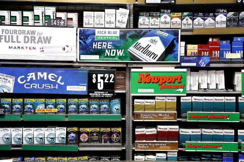 Various brands of Reynolds American cigarettes are displayed at a Smoker Friendly shop in Pittsburgh in this file photo. British American Tobacco on Friday offered $47 billion in a cash-andstock deal to purchase Reynolds. 