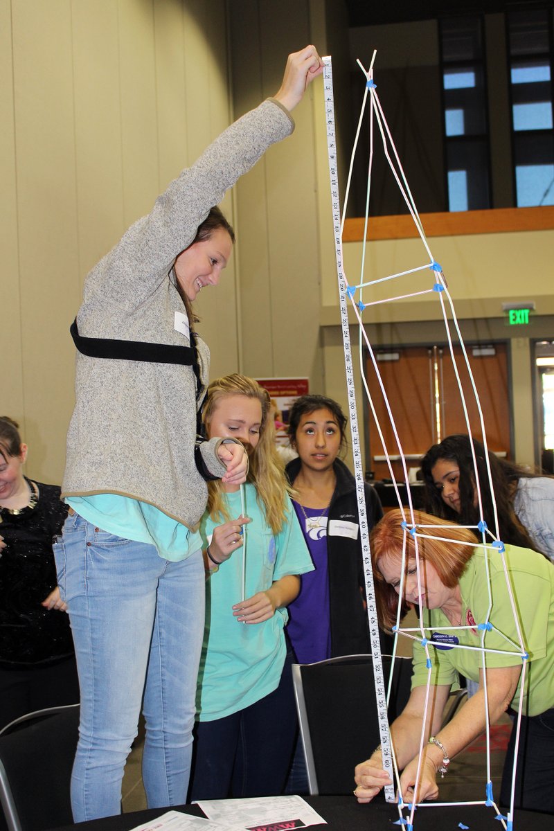 Mentoring to extreme heights: Carolyn Smith, right, science chair for the El Dorado School District, measures a ‘World Tower,’ created by El Dorado High School students and mentors, during a Million Women Mentors event at South Arkansas Community College. The MWM is a mission of Lt. Gov. Tim Griffin designed to encourage girls to enter STEM (Science, technology, engineering and math) fields and he was the keynote speaker during the kick-off event Friday.