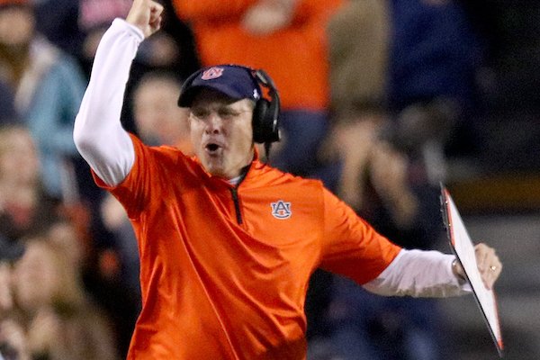 Auburn coach Gus Malzahn celebrates his team's sixth TD in the third quarter Saturday at Jordan-Hare Stadium in Auburn, Ala.