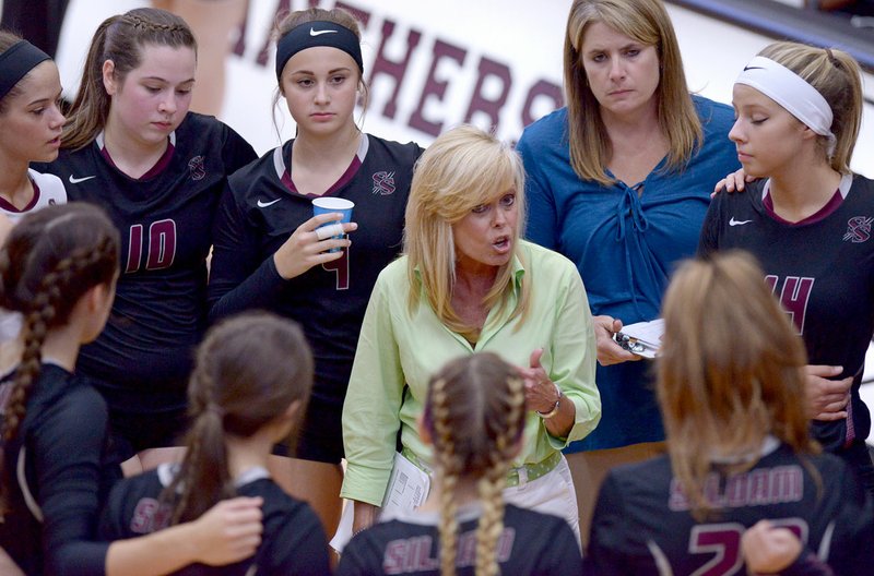 Ben Goff/NWA Democrat-Gazette Rose Cheek-Willis, Siloam Springs head coach, talks to her players during a timeout on in a match against Greenwood earlier this season. Cheek-Willis, who came to Siloam Springs in 1981, is retiring after this season after 35 years as head volleyball coach.