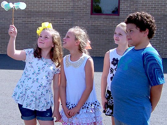 Submitted photo Lake Hamilton Elementary School students, from left, Natalee Brakefield, Emma Jackson, Mollie Margaret Gidcomb and Ben Blancaflor use their anemometer to calculate wind speed on the playground. Students in Jessica Carr's class learned about the weather and made their own anemometers.