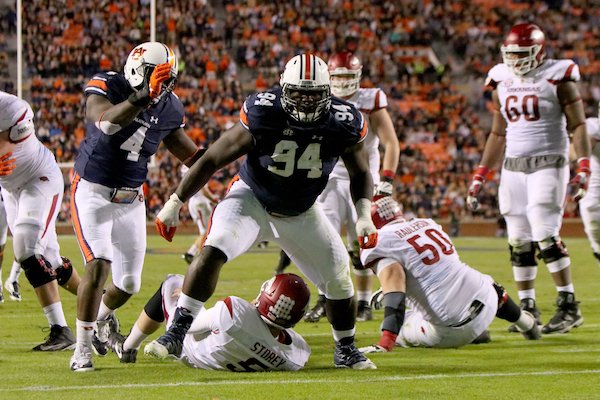 Arkansas' Devaroe Lawrence (94) stands up after sacking Arkansas quarterback Ty Storey deep in Arkansas territory on 3rd and long in the fourth quarter during their game Saturday at Jordan-Hare Stadium in Auburn, Ala.