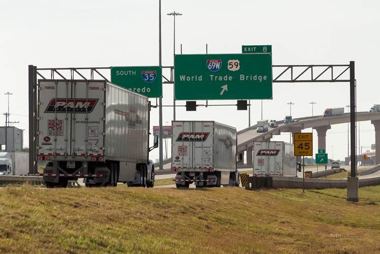 P.A.M. Transportation trucks cross the Mexico border at Laredo, Texas.
