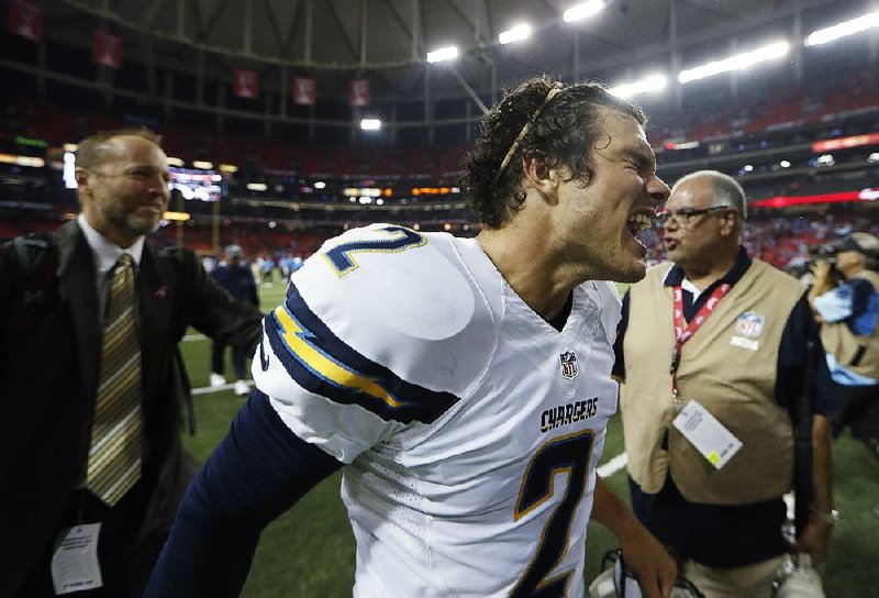 San Diego Chargers kicker Josh Lambo celebrates as he leaves the field after kicking a game-winning, 42-yard field goal in overtime Sunday against the Atlanta Falcons in Atlanta. Lambo sent the game into overtime with a 33-yard fi eld goal at the end of regulation.