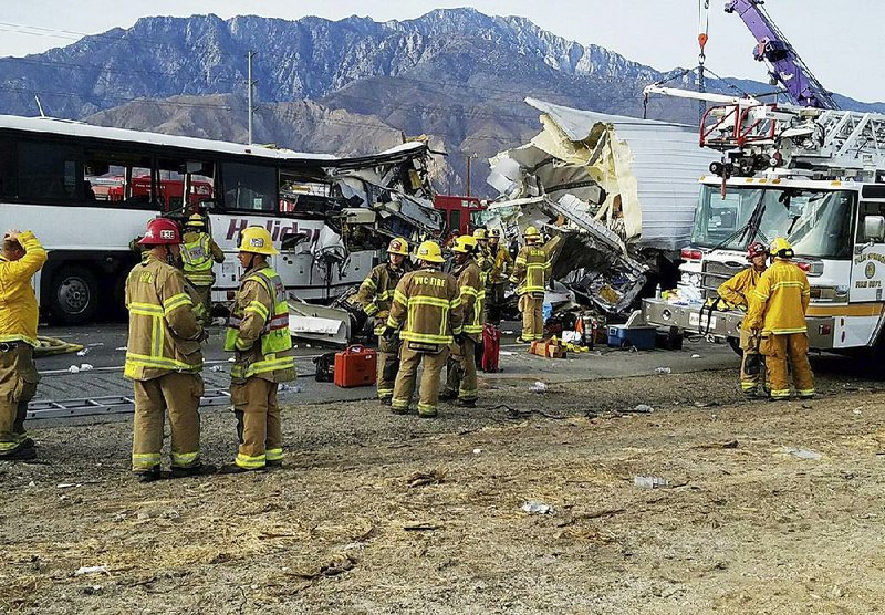 This photo provided by KMIR-TV shows the wreckage from the fatal crash of a tour bus and a tractor-trailer rig Sunday on Interstate 10 near Desert Hot Springs, near Palm Springs, in California’s Mojave Desert.