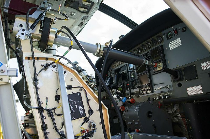 Aurora Flight Sciences’ Aircrew Labor In-Cockpit Automation System is mounted in the co-pilot seat of a Cessna Caravan aircraft last week at Manassas Airport in Manassas, Va., during a demonstration of the system, which seeks to eliminate the need for a second human pilot in the cockpit.