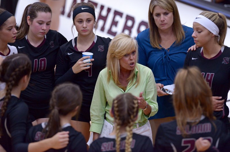 Rose Cheek, Siloam Springs head coach, talks to her players during a timeout on Thursday Sept. 15, 2016 during the match against Greenwood in Siloam's Panther Activity Center. 