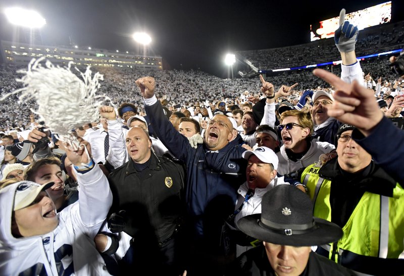 Penn State coach James Franklin, center, celebrates with the crowd after the team's 24-21 win over Ohio State during an NCAA college football game Saturday, Oct. 22, 2016, in State College, Pa. 