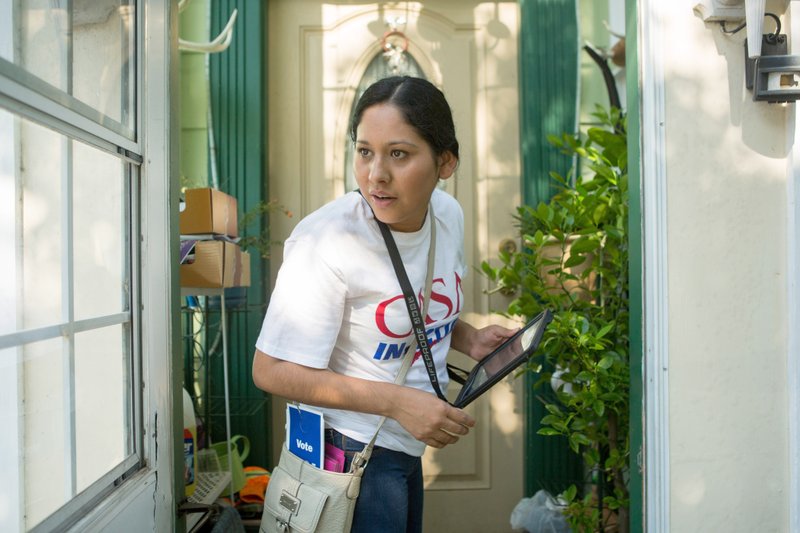 Nayely Lopez, 29, prepares to knock on the door of a registered voter in Woodbridge, Virginia. 