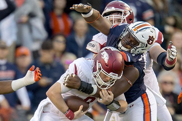 Arkansas quarterback Austin Allen (8) is sacked by Auburn defensive lineman Andrew Williams (79) on Saturday, Oct. 22, 2016, at Jordan-Hare Stadium in Auburn, Ala.