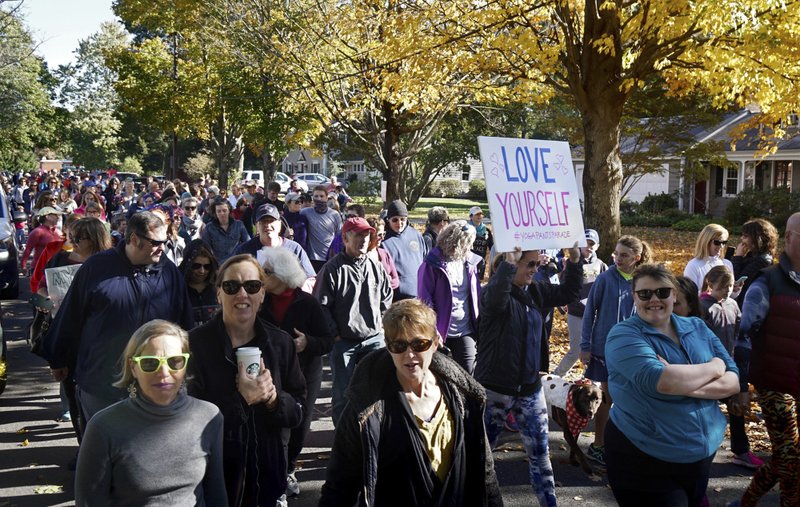 People march for "yoga pants parade" in Barrington, R.I., Sunday, Oct. 23, 2016. Hundreds of women, girls and other supporters proudly donned their yoga pants Sunday afternoon as they peacefully paraded around the Rhode Island neighborhood of a man who derided the attire as tacky and ridiculous. (Kris Craig/Providence Journal via AP)
