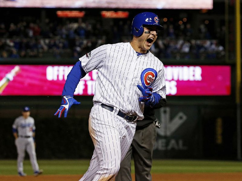 Chicago Cubs first baseman Anthony Rizzo (44) celebrates as he runs bases after hitting a home run during the fifth inning of Game 6 of the National League baseball championship series against the Los Angeles Dodgers, Saturday, Oct. 22, 2016, in Chicago.