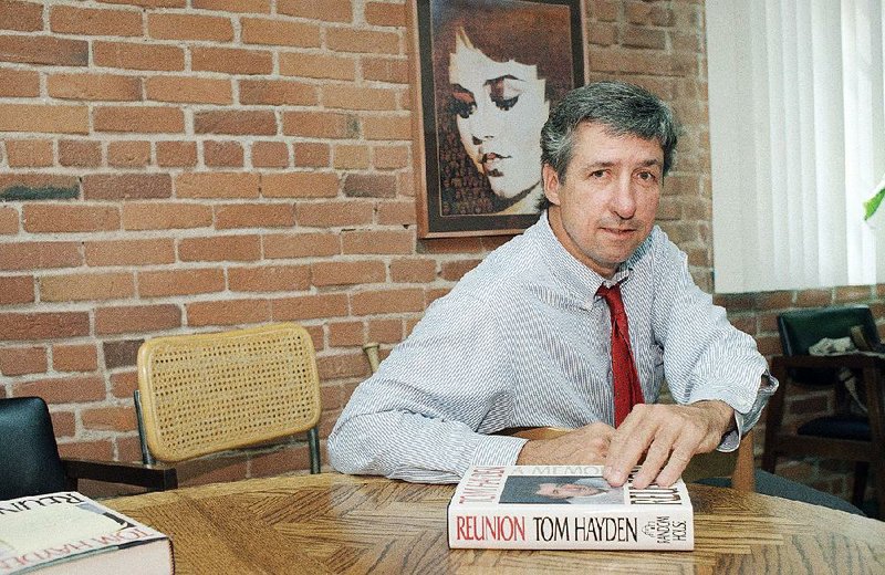 In this June 6, 1988 file photo, Tom Hayden talks about his new book, "Reunion," during a interview at his office in Santa Monica, Calif. 