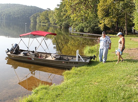 The Sentinel-Record/Richard Rasmussen PARK OF THE YEAR: Two campers prepare to boat out onto Lake Catherine in late August in this file photo. Lake Catherine State Park received "Park of the Year" for Arkansas State Parks Region 1 for its commitment to excellence.