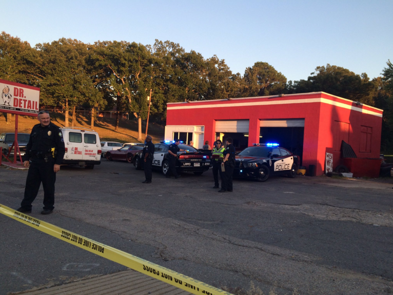 Police investigate a fatal shooting at Dr. Detail, an auto detail shop at 7101 Colonel Glenn Road, on Monday afternoon.
