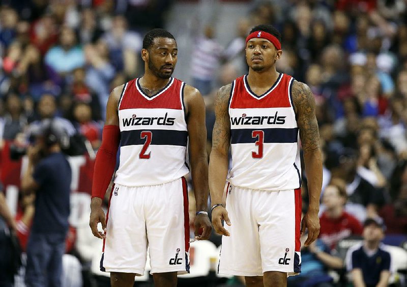 Washington guards John Wall (left) and Bradley Beal have to share the limelight in the backcourt if they’re going to lead the Wizards back to the playoffs. Wall is healthy again after having surgery on each knee, and Beal is fresh off signing a five-year, $128 million contract that ranked among the richest in the NBA during the offseason.