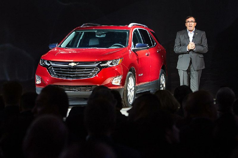 General Motors President of North America Alan Batey introduces the 2018 Chevrolet Equinox compact SUV, in Chicago in September in this photo provided by GM. The automaker on Tuesday reported a third-quarter profit of $2.8 billion. 