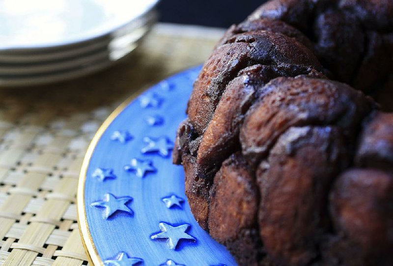 Death by Chocolate Monkey Bread combines refrigerated biscuits, cocoa powder, sugar and chocolate chips for a sweet, sticky, chocolatey treat. 