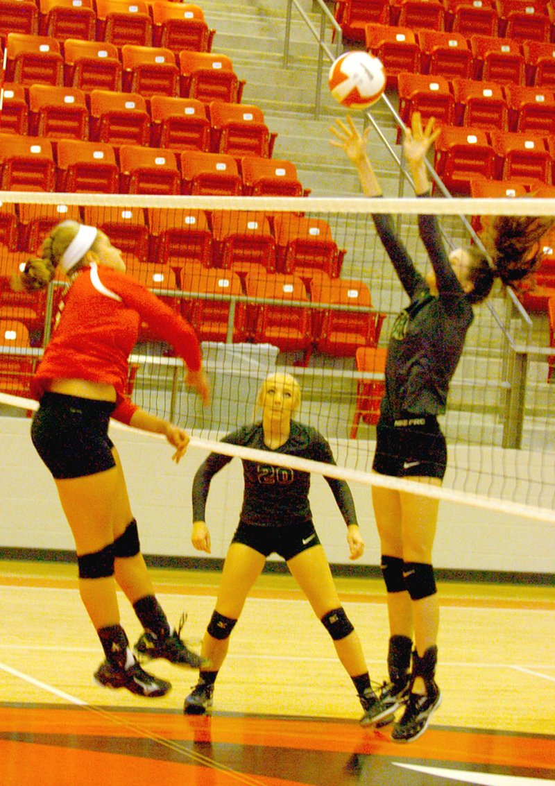 MARK HUMPHREY ENTERPRISE-LEADER Farmington senior Anna Dutton pounds a hit during an Oct. 6, 17-25, 25-21, 25-18, 25-19 victory over 5A West rival Alma. During state tourney play this week, the Lady Cardinals seek to regain momentum picked up during the match with Alma that sparked wins over 7A Rogers Heritage, 6A Russellville and 3A power Paris.