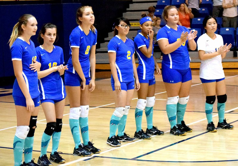 Photo by Mike Eckels Members of Decatur&#8217;s senior girls volleyball team wait for the match to start at Shiloh Christian in Springdale Aug. 30. Members of the team pictured include: Taylor Hopkins, Coral Frydrychowski, Talor Thompson, Shaney Lee, Desi Meek, Cameron Shaffer and Mailee Xiong.