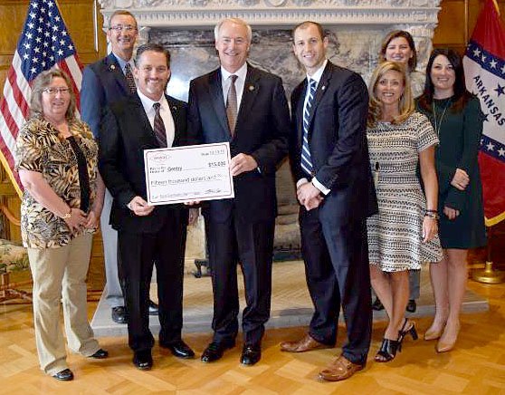 Submitted Photo NWAEDD Tina Cole, ARDC commissioner James Myatt, Governor Asa Hutchinson, AEDC executive director Mike Preston, AEDC vice president of operations Amy Fecher, ARDC commissioner Jamie Pafford-Gresham and Rural Services director Alex Johnston on Thursday, Oct. 13, at the Governor&#8217;s Mansion in Little Rock, presented $15,000 to Gentry Mayor Kevin Johnston for the city of Gentry to build paved walking trails in the Flint Creek Nature Area.