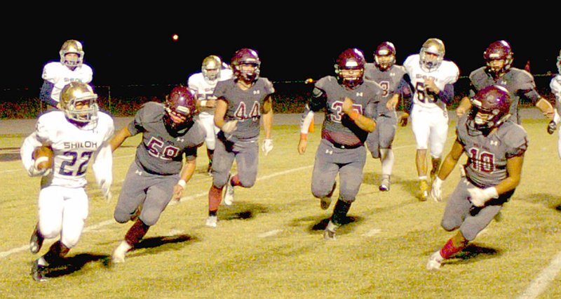 MARK HUMPHREY ENTERPRISE-LEADER Shiloh runningback I&#8217;Juan Litzey runs the football against Lincoln. The Wolves were defeated by the Saints, 49-0, Friday.