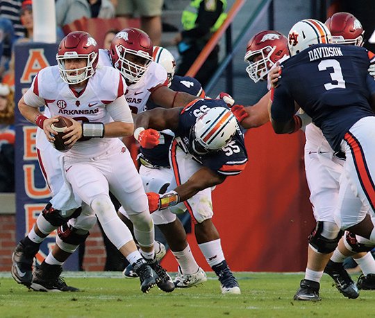 NWA Democrat-Gazette/Stephen B. Thornton NOWHERE TO GO: Arkansas quarterback Austin Allen scrambles out of the pocket on his way to a fumble during the first quarter of the Razorbacks' game against Auburn Saturday at Jordan-Hare Stadium. Arkansas was held without a touchdown in a humbling 56-3 loss to the Tigers.