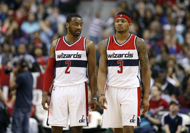 The Associated Press DYNAMIC DUO: Washington Wizards guards John Wall (2) and Bradley Beal (3) stand on the court during an NBA basketball game against the Minnesota Timberwolves on March 25. Wall is healthy again after having surgery on each knee, and Beal is fresh off signing a $128 million, five-year contract that ranked among the richest in the NBA this offseason.