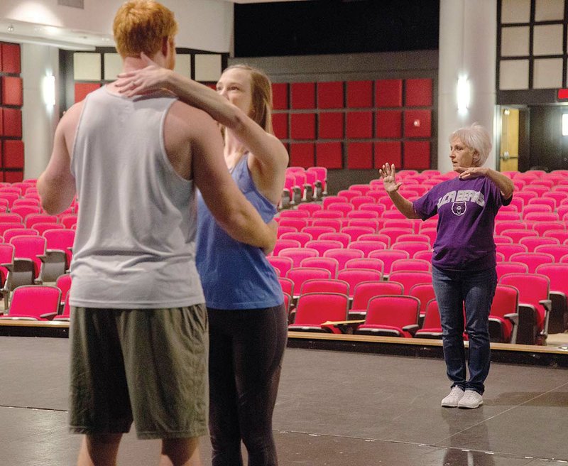 Choreographer Priscilla Morris, right, gives instructions as Dancing With the Cabot Stars participants Riley Hawkins and Kristi-Page Danielson prepare to rehearse the opening number of this year’s event.