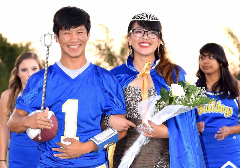 The 2016 Decatur Homecoming king and queen, Leng Lee and Shaney Lee, stand before the crowd during their coronation Oct. 21 at Bulldog Stadium in Decatur.