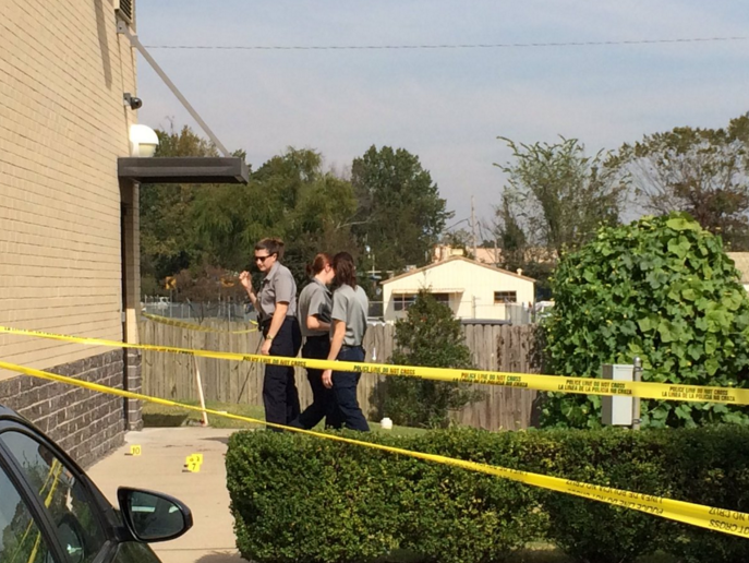 Police investigate the scene of a shooting outside a Little Rock motel Wednesday.