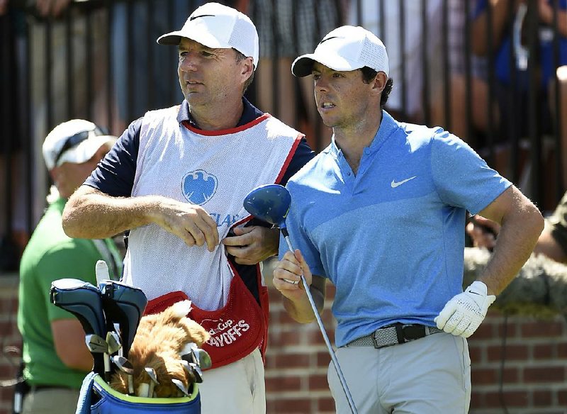 Rory McIlroy received a nice hunk of change for winning the PGA Tour Championship and FedEx Cup, so he decided to spread the wealth to his caddie, J.P. Fitzgerald (left).