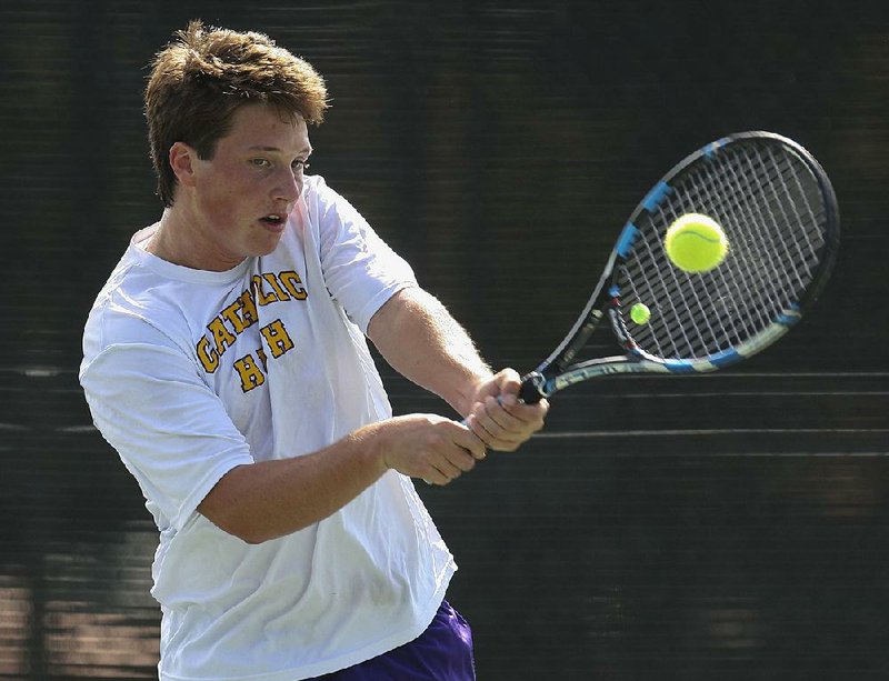 Little Rock Catholic’s Parker Stearns returns a shot during his 6-2, 6-3 quarterfinal victory over Greenwood’s Andrew Anderson on Wednesday at the Overall state tennis tournament in North Little Rock. 