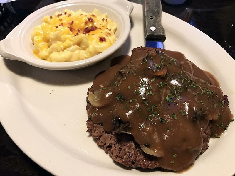 Salisbury steak, served here with macaroni and cheese, is a “Serious Meal” at JJ’s Grill. 