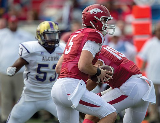 NWA Democrat-Gazette/Jason Ivester IN RESERVE: Redshirt freshman quarterback Ty Storey works against Alcorn State in an early-season Razorback victory at Little Rock's War Memorial Stadium. With junior starting quarterback Austin Allen nursing a sprained knee suffered against Auburn, Storey and redshirting freshman Cole Kelley are getting practice time in Arkansas' off week before a Nov. 5 home game against Florida.