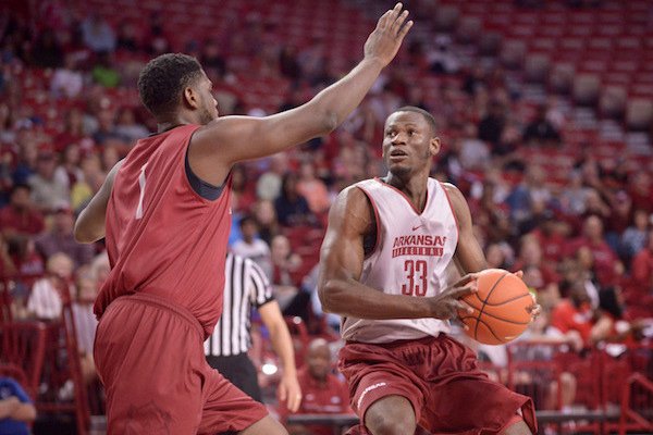 Trey Thompson of red team guards Moses Kingsley (33) of white on Sunday Oct. 23, 2016 during the Arkansas Red-White game at Bud Walton Arena in Fayetteiville.