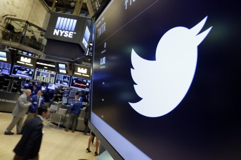 FILE - In this July 27, 2016, file photo, the Twitter symbol appears above a trading post on the floor of the New York Stock Exchange. Twitter, seemingly unable to find a buyer and losing money, is cutting about 9 percent of its employees worldwide. The company also announced third-quarter results Thursday, Oct. 27. (AP Photo/Richard Drew, File)
