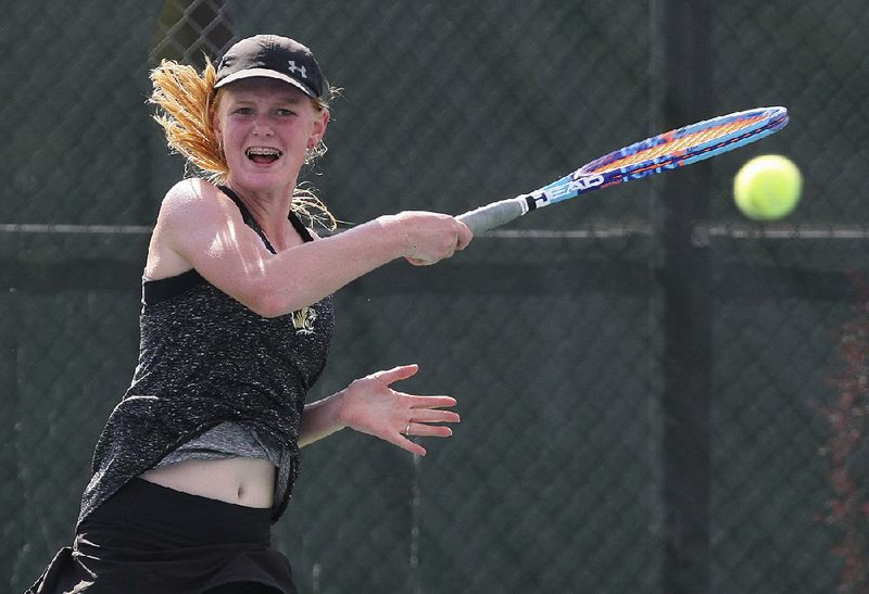 Bentonville’s Brooke Killingsworth returns a shot during Thursday’s girls singles final against Presley Southerland in the overall tennis tournament at Burns Park in North Little Rock. Killingworth won 6-2, 6-3 to claim the girls title.