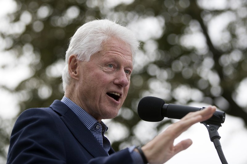 In this Oct. 14, 2016, file photo, former President Bill Clinton campaigns for his wife, Democratic presidential candidate Hillary Clinton, at Washington Park in Cincinnati.