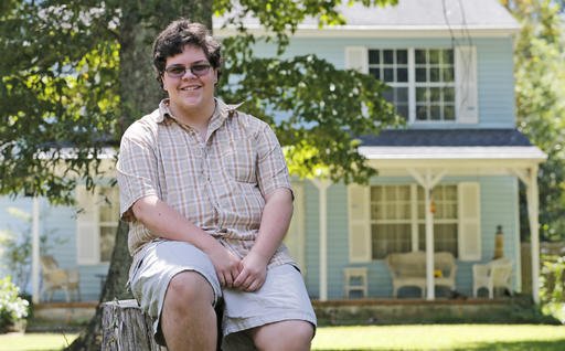 In this Monday Aug. 22, 2016 file photo, transgender high school student Gavin Grimm poses in front of his home in Gloucester, Va. 