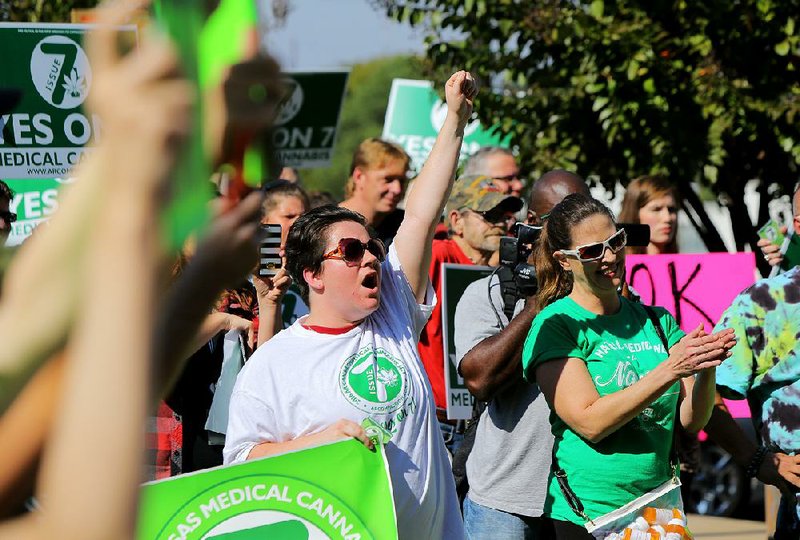Supporters of the Arkansas Medical Cannabis Act, also known as Issue 7, cheer a speaker during a rally Friday outside the Arkansas Supreme Court in Little Rock.