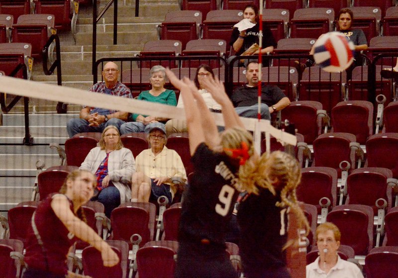 Graham Thomas/Siloam Sunday Siloam Springs sophomore Ellie Lampton hits the ball past Jonesboro&#8217;s block during Wednesday&#8217;s 6A state tournament match at Wolf Arena at Lake Hamilton.