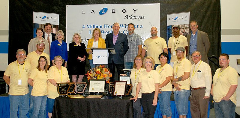 Janelle Jessen/Herald-Leader La-Z-Boy Siloam Springs received several awards on Thursday from state officials for exceeding four million hours of work without a lost-time injury. Pictured are (front left) Verlin Vogt, Stacy Hill, Wilma Eberley, Becky Bruner, Audra Farrell, Velma Blackfox, Aaron Signoretti, Michael Frawley, Steven Robbins (back left), Dustin Murley, Morgan Farmer, Ralph Hudson, Katherine Gough, Barbara Webb, Robin Lundstrum, Kevin Harmon, Brad Burns, Tim Blevins, Dickson Agbehi and Steve Beers.